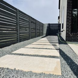 Everything was dirt and weeds before, beautiful honed cream limestone slabs and black star gravel  installed