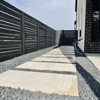 Constant Lawn and Gardener - Everything was dirt and weeds before, beautiful honed cream limestone slabs and black star gravel  installed - Tree Services Near Me