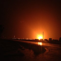 The Flame Convenience store - The night skies light up from the gas flares. That is how our store got its name The Flame