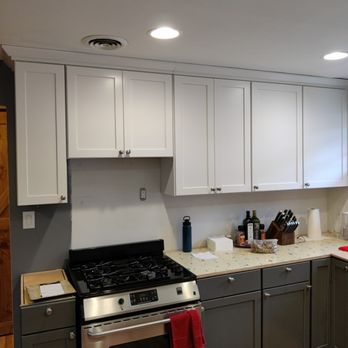 Earls Home Services - a kitchen with white cabinets and stainless steel appliances - Siding Near Me Earls Home Services - a kitchen with white cabinets and stainless steel appliances - Siding Near Me