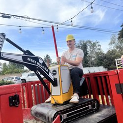 BookMiniDigger - One of guests riding the digger!