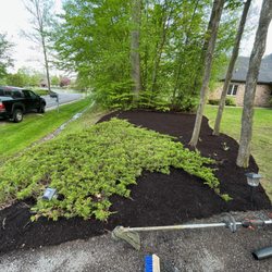 Strong Arm Services - Established mulch bed and created edge. Planted lilies.