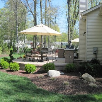 Turf Trimmers Landscaping - a patio with a table and chairs - Landscaping Near Me - Kent, Ohio Turf Trimmers Landscaping - a patio with a table and chairs - Landscaping Near Me - Kent, Ohio