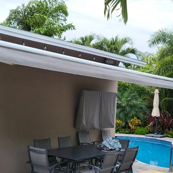 Harrison Awnings - 22' Motorized SunPro Brand Retractable Awning with a White frame and gray fabric by Sunbrella - in Wilton Manors - Awnings Near Me Harrison Awnings - 22' Motorized SunPro Brand Retractable Awning with a White frame and gray fabric by Sunbrella - in Wilton Manors - Awnings Near Me