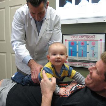 Pontious Chiropractic - Dr. Pontious performing adjustment on a baby. - Chiropractors Near Me - Danville, California Pontious Chiropractic - Dr. Pontious performing adjustment on a baby. - Chiropractors Near Me - Danville, California