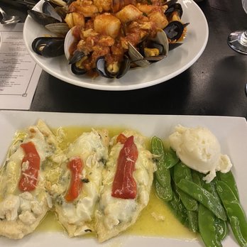 Fieni's Ristorante - Chicken Granchi and seafood on a bed of pasta (lobster, perfectly cooked scallops, mussels, clams, and crab meat) it was delicious. - Italian Near Me - Voorhees Township, New Jersey