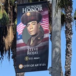 City of Artesia - We Proudly Honor banner on a streetlight