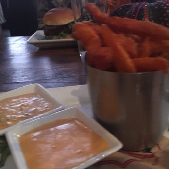 Sur at The Barnyard - Sweet potato fries and Veggie Burger (in background) - New American Near Me - Carmel, California Sur at The Barnyard - Sweet potato fries and Veggie Burger (in background) - New American Near Me - Carmel, California