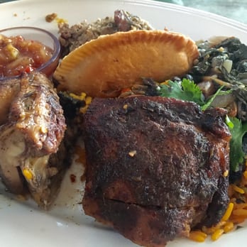 Bahama Breeze - A combo of empanada, roasted chicken, greens, yellow rice, plantain and salsa - Bars Near Me - Troy, Michigan