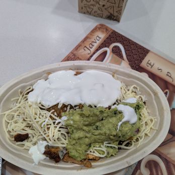 Chipotle Mexican Grill - Chicken burrito bowl with white cilantro rice, no beans, medium spicy salsa, cheese, sour cream, and guacamole. About 13 dollars total - Mexican Near Me - Windermere, Florida