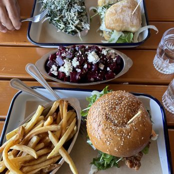Joinery - Fried Chicken Sandwich, marinated beets, French fries, sautéed rainbow chard, and Tuna Conserva Sandwich - American Near Me - Sausalito, California Joinery - Fried Chicken Sandwich, marinated beets, French fries, sautéed rainbow chard, and Tuna Conserva Sandwich - American Near Me - Sausalito, California