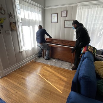 JPX Piano Mover - Joseph moving the piano into place. - Movers Near Me JPX Piano Mover - Joseph moving the piano into place. - Movers Near Me
