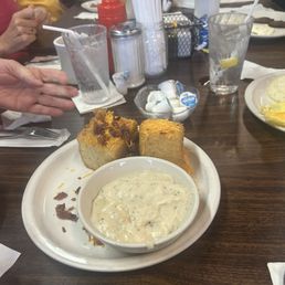 Fried grits with sausage gravy on the side. Fried grits with sausage gravy on the side.