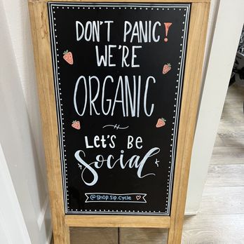The Coco Bean - a sign that says don't panic we're organic let's be social - Coffee & Tea Near Me - Tyler, Texas