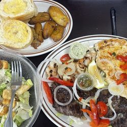 Mar y tierra is surf and turf ! 5 shrimp, huge steak and chicken! A family of four can survive on this. 5. w Sweet Plantains
