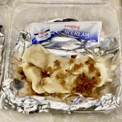 Soft flavorful creamy buttery potato pierogis, thin tender dough, topped with grilled caramelized onion