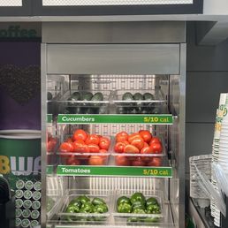 a display of tomatoes and peppers