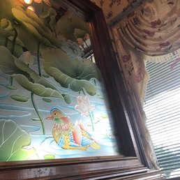 a painting of a fish in a pond a painting of a fish in a pond