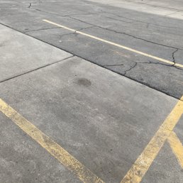 The parking lot is very damaged. Should be repaired it should be repaired; it makes it hard for disabled people in walkers j