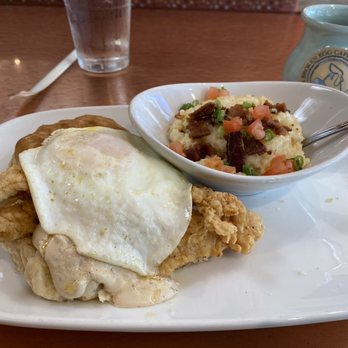 Another Broken Egg Cafe - City grits, biscuit, chicken tender, egg and gravy. - Breakfast & Brunch Near Me - Clearwater Beach, Florida