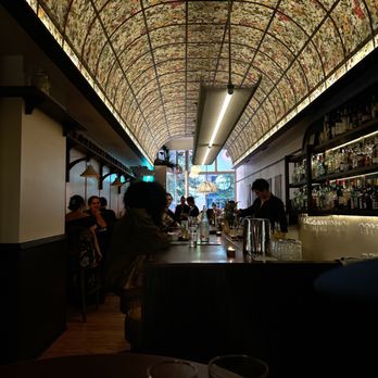 Florette - people sitting at a bar - Cocktail Bars Near Me - Toronto, Ontario
