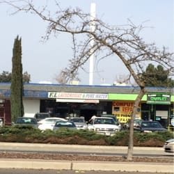 FL Laundromat & Purewater - View from across the street. Spot is a few doors down from Pizza Hut