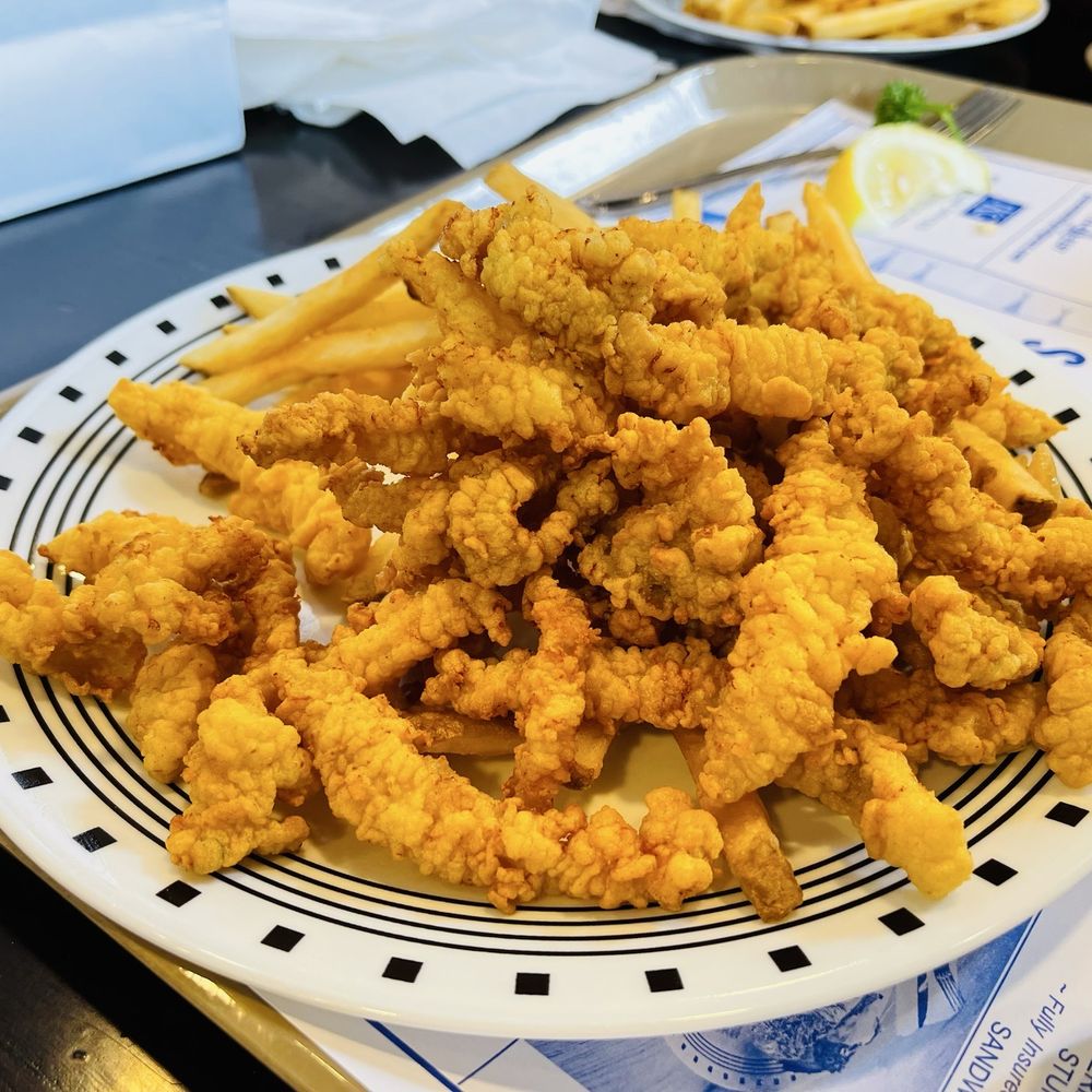Strip clams plate - lots of bland, tasteless food Strip clams plate - lots of bland, tasteless food