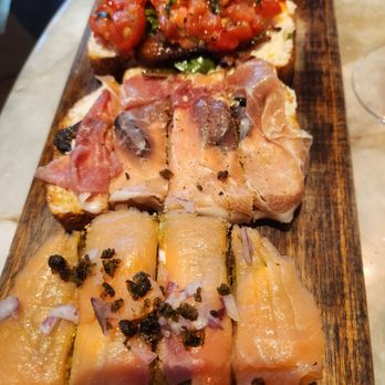 Postino Ballantyne - Bruschetta Board *Buratta, Bacon, Tomatoes - Wine Bars Near Me - Charlotte, North Carolina Postino Ballantyne - Bruschetta Board *Buratta, Bacon, Tomatoes - Wine Bars Near Me - Charlotte, North Carolina