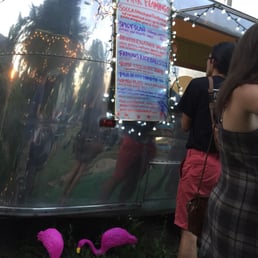 people standing in front of an airstream