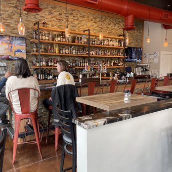 Charred Oak Kitchen and Bar - people sitting at the bar - New American Near Me - Columbus, Georgia