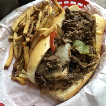 Tat's Delicatessen - 8" Cheese Steak (with included amount of whiz) $10.50 with small fries $2.25 - Delis Near Me - Seattle, Washington Tat's Delicatessen - 8" Cheese Steak (with included amount of whiz) $10.50 with small fries $2.25 - Delis Near Me - Seattle, Washington
