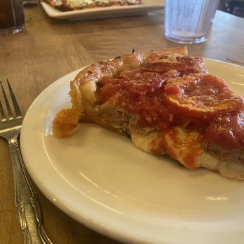 Lou Malnati's Pizzeria - It's like where pizza meets lasagna! Buttercrust, sausage, spinach mix, sliced tomatoes. - Pizza Near Me - Chicago, Illinois