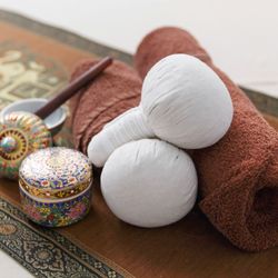 Thai Tranquility Bodywork - Traditional herbal compress for deep warmth and relaxation.