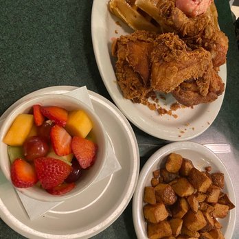 Metro Diner - Fried Chicken Waffle Breakfast, homefries, fruit bowl. YUMMY - American Near Me - Bradenton, Florida