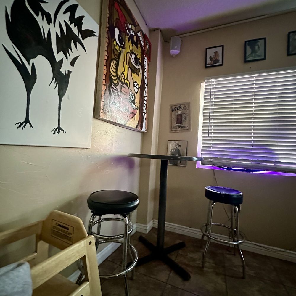 Black Cock Brewery - Corner table and cool art - Brewpubs Near Me - Roswell, New Mexico Black Cock Brewery - Corner table and cool art - Brewpubs Near Me - Roswell, New Mexico