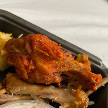 Wingstop - a tray of food on a table - Chicken Wings Near Me - Moreno Valley, California Wingstop - a tray of food on a table - Chicken Wings Near Me - Moreno Valley, California