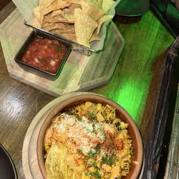 Chips and salsa and the street corn off the cob with plantain chips.