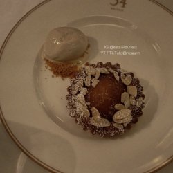 Poached pear & almond tart - £14.50, $19.21