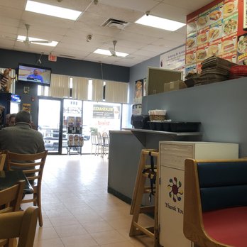 Doggie Diner - a man sitting at a table - Hot Dogs Near Me - Plainfield, Illinois