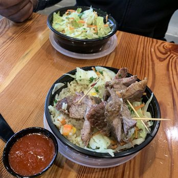 African Dream Cuisine - Brisket skewers with cabbage, rice, and unknown sauce - African Near Me - Lenexa, Kansas African Dream Cuisine - Brisket skewers with cabbage, rice, and unknown sauce - African Near Me - Lenexa, Kansas