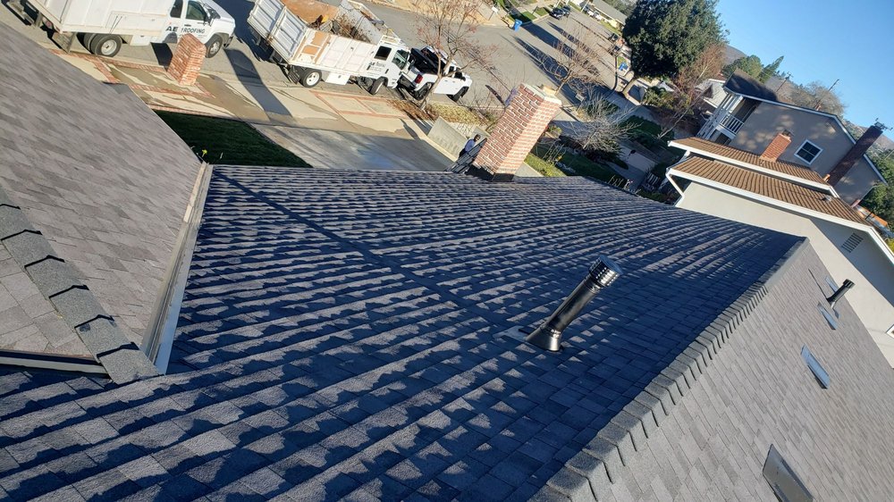 Slide of AE Roofing Experts