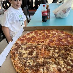 Midtown Pizza - Take out NY Pie w bacon and pepperoni.