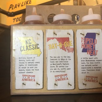 Mission BBQ - They have 6 different types of homemade bbq sauce, descriptions on the holder - Barbeque Near Me - Chattanooga, Tennessee
