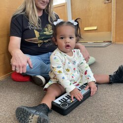 Sarah Smith Music Lessons - Toddler student playing piano  in a Toddler music class.