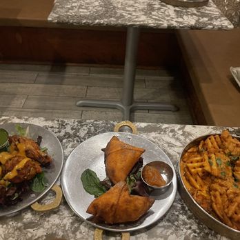 Curryosity - (Left to Right) Dynamite Spice Wings, Cheese Samosa, Curry Fries - Indian Near Me - San Diego, California Curryosity - (Left to Right) Dynamite Spice Wings, Cheese Samosa, Curry Fries - Indian Near Me - San Diego, California