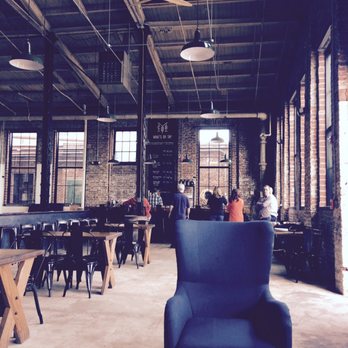 Monument City Brewing - Seating area and bar - Breweries Near Me - Baltimore, Maryland