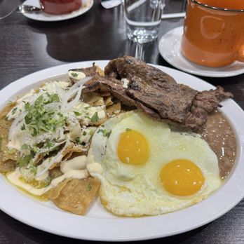 Orale Guey - Los Famosos Chilaquiles with the added skirt steak. - Mexican Near Me - Columbus, Ohio Orale Guey - Los Famosos Chilaquiles with the added skirt steak. - Mexican Near Me - Columbus, Ohio