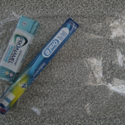 Bailey and Wright Dentistry - Goody bag with a new tooth brush, tooth paste & floss.