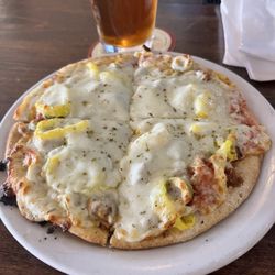 Villaggio's Italian Eatery - My pie size with sausage, banana peppers, and green olives.