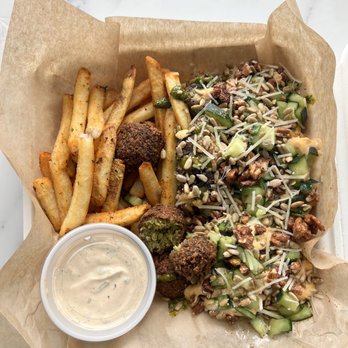 Tazā - a tray of food with fries and a side of sauce - Mediterranean Near Me - Chanhassen, Minnesota Tazā - a tray of food with fries and a side of sauce - Mediterranean Near Me - Chanhassen, Minnesota